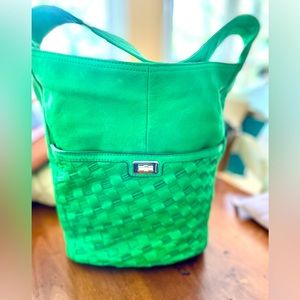 Never used, Kelly green leather bucket bag. Front and rear outside pockets.